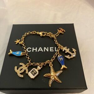 New authentic Chanel Gold and Blue Charm Bracelet